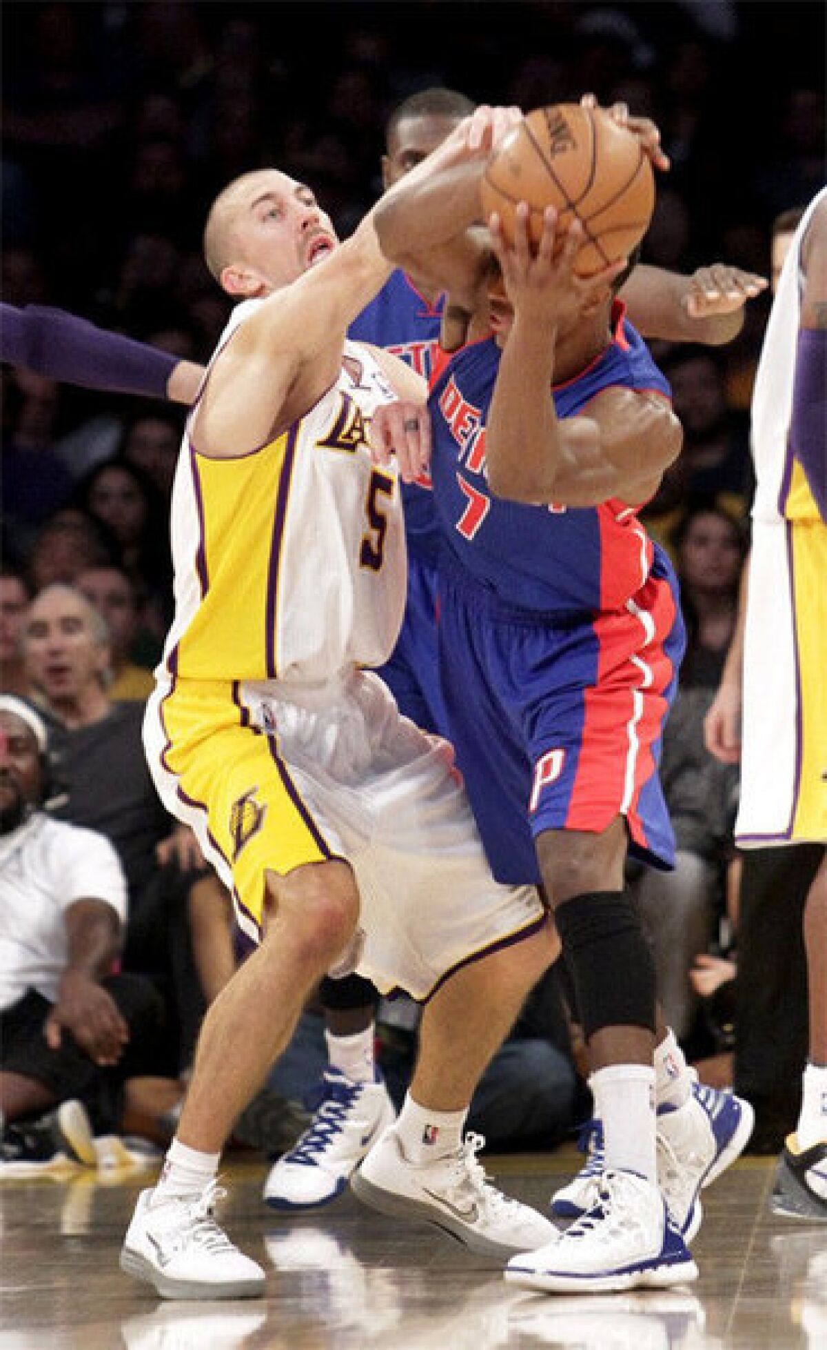 Steve Blake pressures Detroit Pistons guard Brandon Knight in their game at Staples Center.