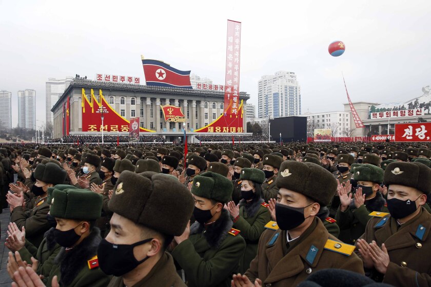 North Korean soldiers applaud Kim Jong Un in Pyongyang. 