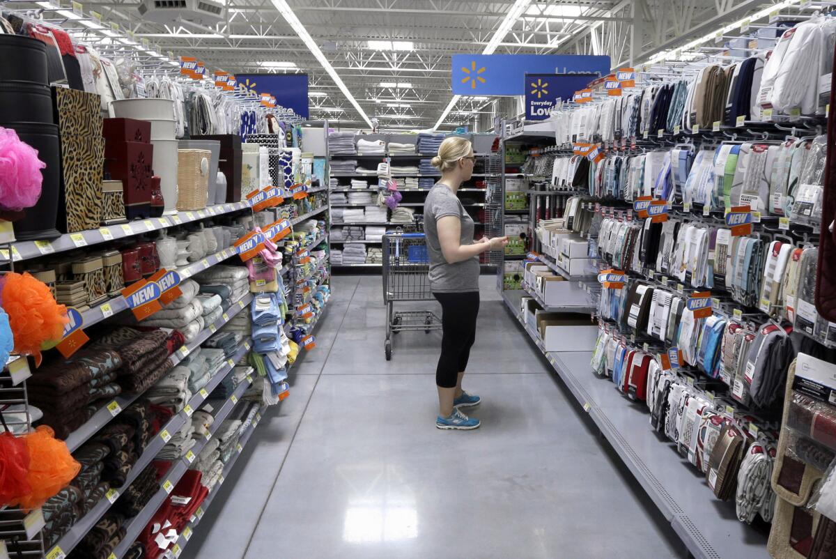 A customer shops for home accessories at a Wal-Mart Supercenter store in Springdale, Ark., on June 4.