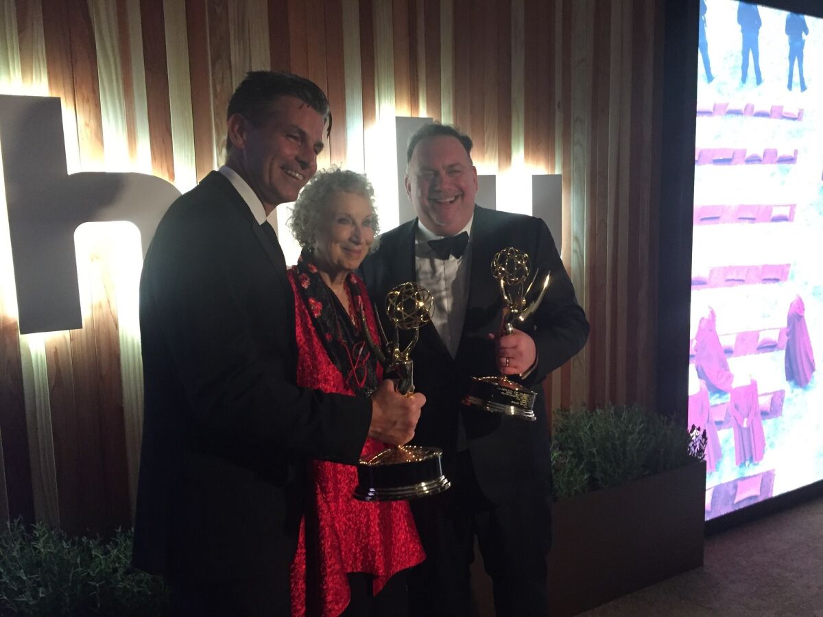 Hulu CEO Mike Hopkins, author Margaret Atwood and writer-producer Bruce Miller celebrate "The Handmaid's Tale's" Emmy win for best drama at the Hulu party.