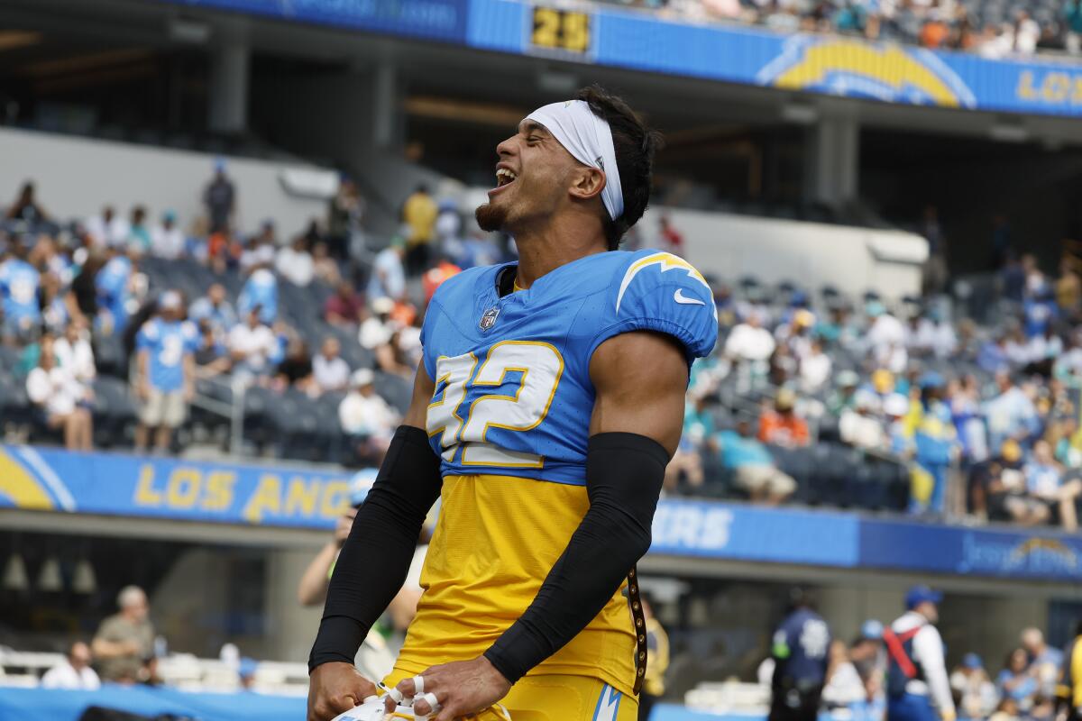 Chargers safety Alohi Gilman (32) yells to fans before a game against the Miami Dolphins.
