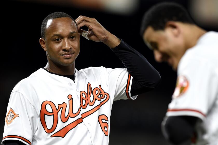 Baltimore Orioles' Jonathan Schoop, left, and Manny Machado during a baseball game against the Kansas City Royals, Wednesday, Aug. 2, 2017, in Baltimore. (AP Photo/Gail Burton)