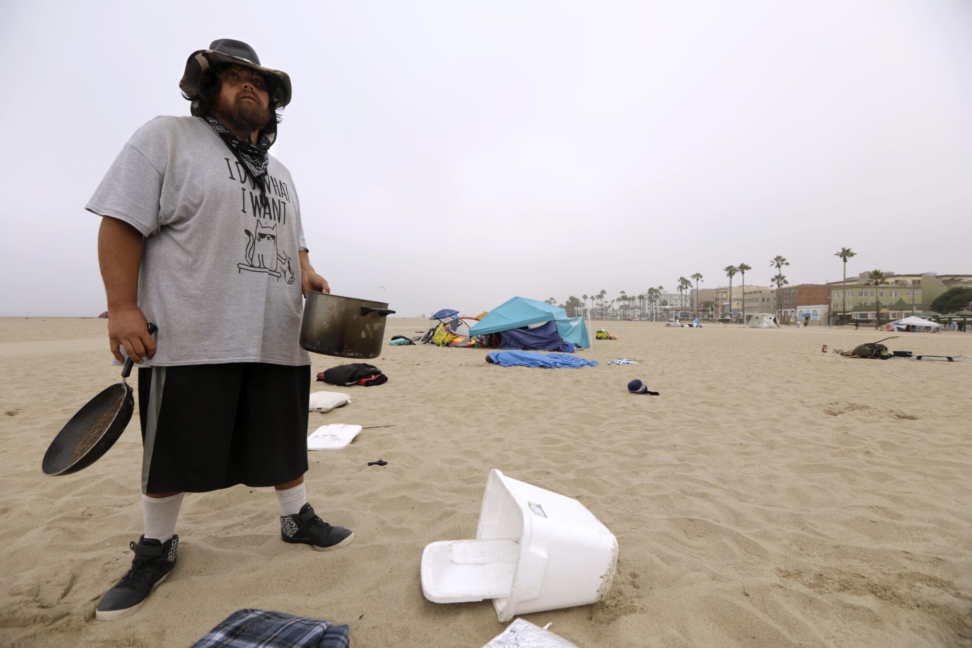 Kenny Carpenter, 34, collects his belongings before sanitation crews arrived in Venice 