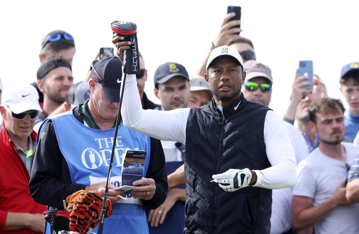 U.S golfer Tiger Woods prepares to tee off on the 7th hole during a practice round at the British Open golf championship on the Old Course at St. Andrews, Scotland, Monday July 11, 2022. The Open Championship returns to the home of golf on July 14-17, 2022, to celebrate the 150th edition of the sport's oldest championship, which dates to 1860 and was first played at St. Andrews in 1873. (AP Photo/Peter Morrison)