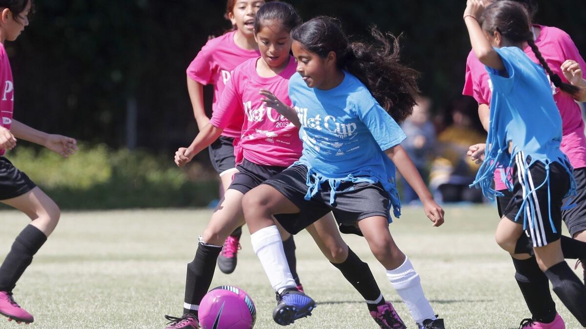Victoria Elementary's Aisleen Avalos, center, competes against Whittier in a girls' third- and fourth-grade Silver Division pool-play match at the Daily Pilot Cup on Thursday at Jack R. Hammett Sports Complex in Costa Mesa.