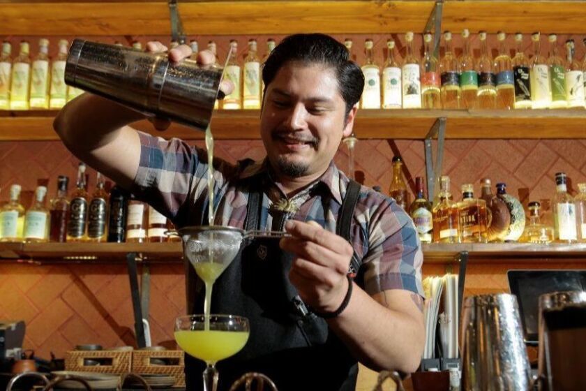 Torrence, CA - March 20, 2019: Food review of MADRE! restaurant's Torrence, Ca. location photographed March 20, 2019. Bartender Bryant Orozco mixes up some cocktails made with a favorite Mezcal for the lunch crowd. (Elizabeth Lippman for the Los Angeles Times)