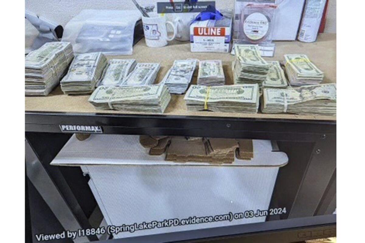 Cash from a bag that was left at the home of a juror in Minneapolis, Minn., in a massive fraud case. 
