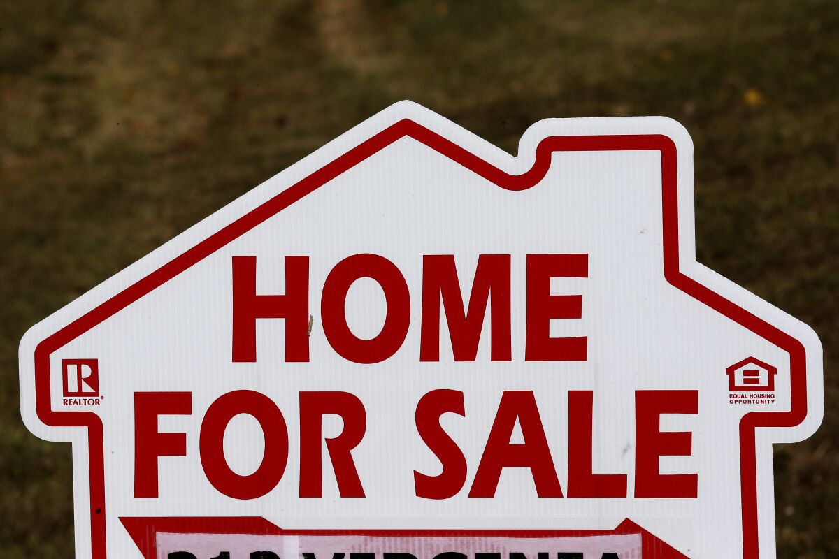 A home for sale sign in Orange County near Hillsborough, N.C. 