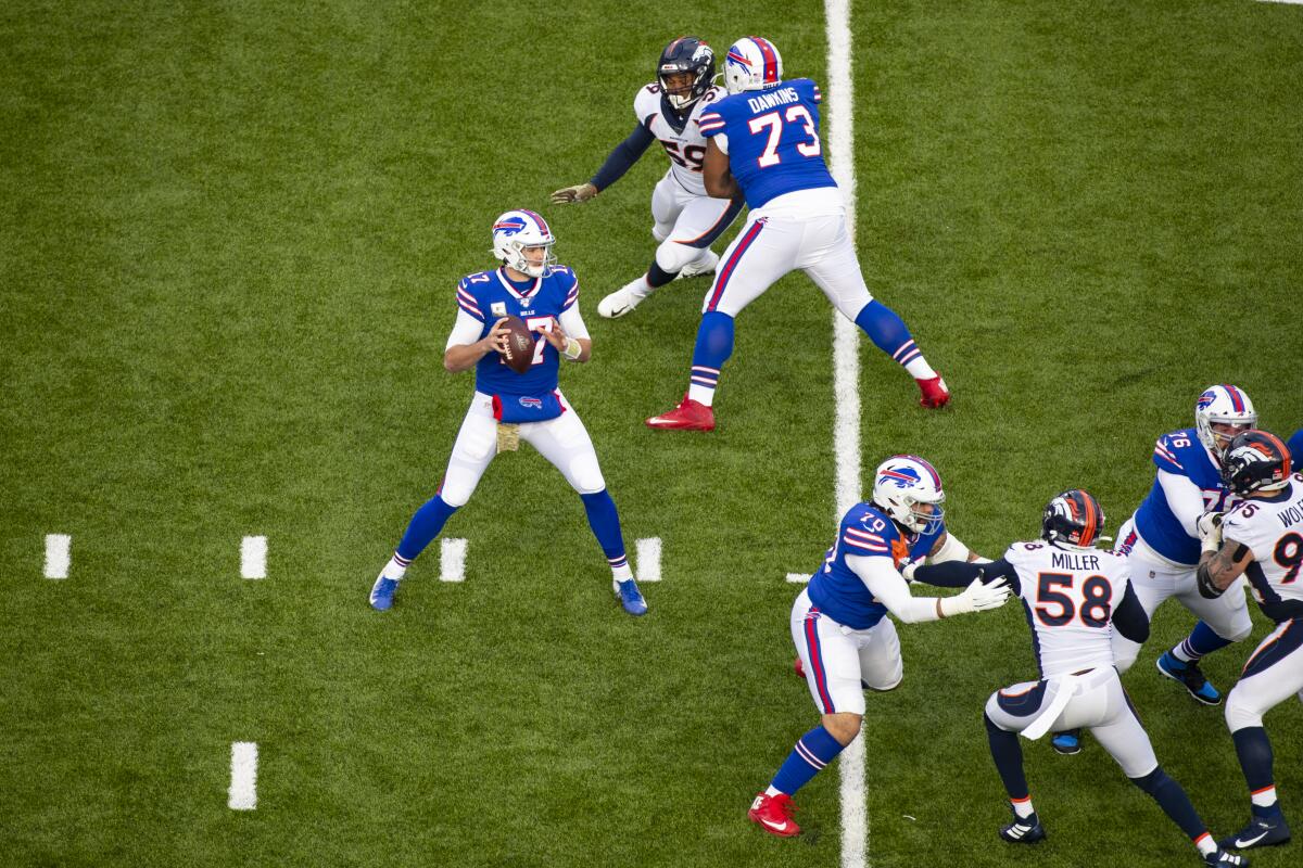 Buffalo Bills quarterback Josh Allen drops back to pass.