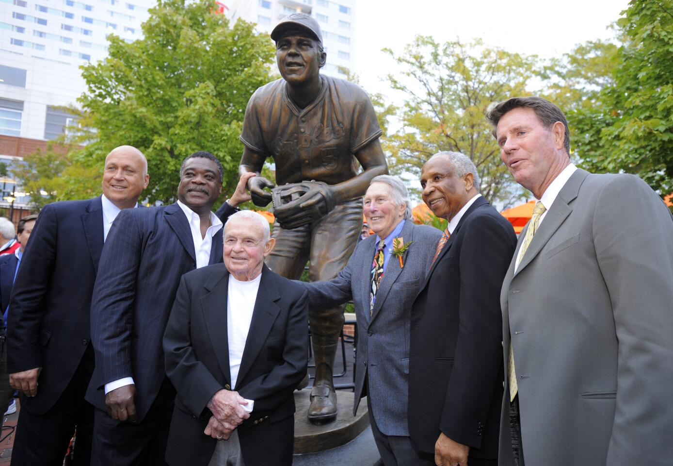 Baltimore Oriole Hall of Famers, from left, Cal Ripken Jr., Eddie Murray, Earl Weaver, Brooks Robinson, Frank Robinson and Jim Palmer pose for a photo as the Orioles unveiled the Brooks Robinson statue at Camden Yards in Baltimore on Sept. 29, 2012.