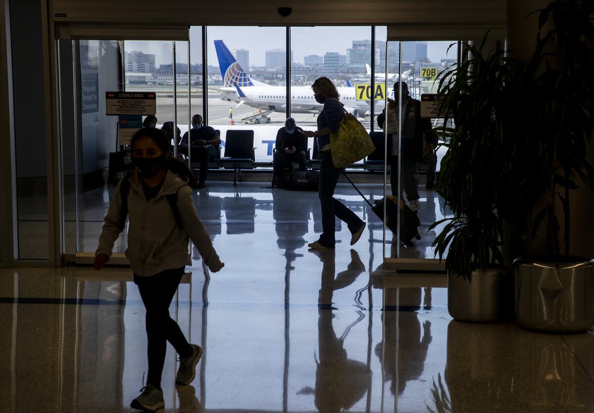 Air travelers navigate Terminal 7 at LAX. 