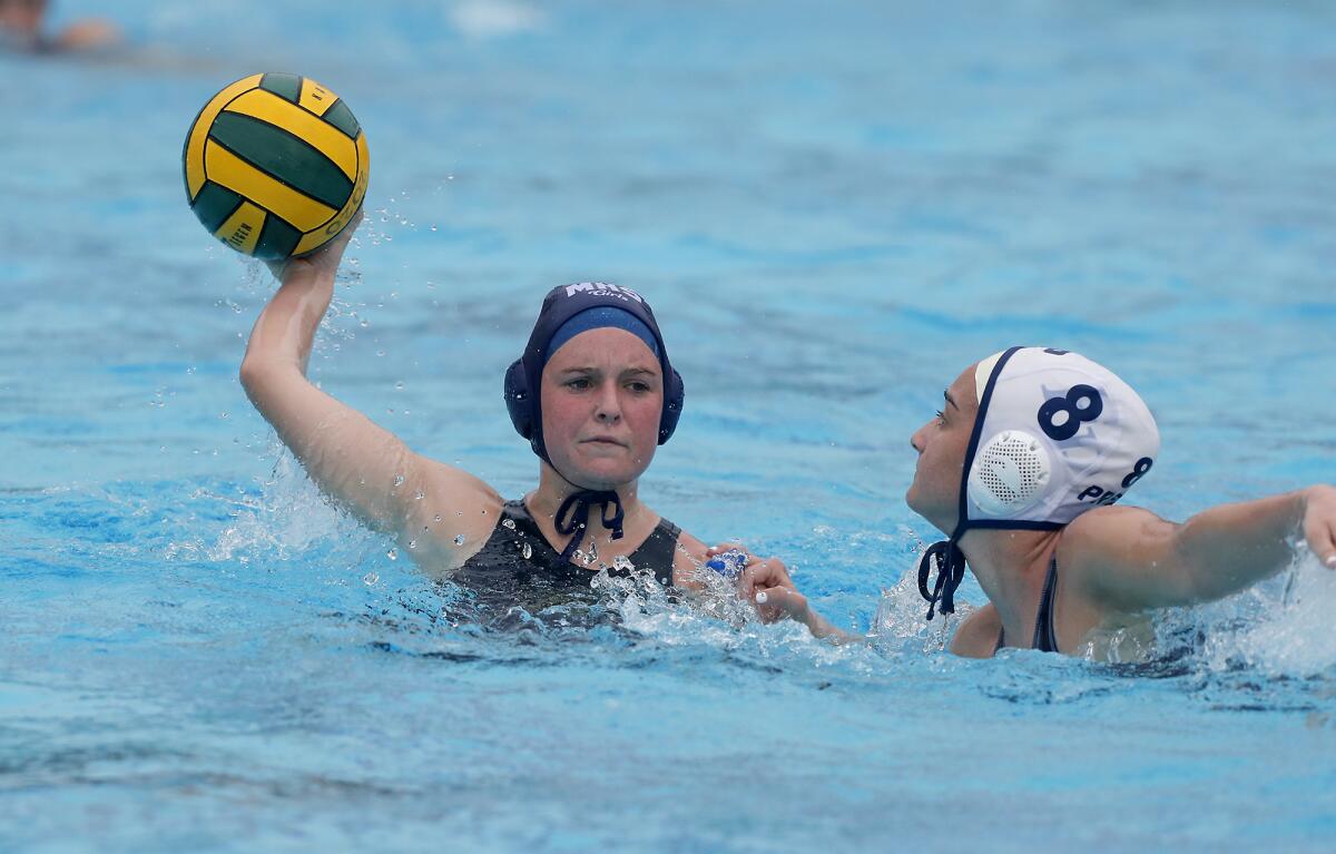 Marina's Lana Kardos competes against Flintridge Prep's Natalie Kaplanyan (8) during the second half in the CIF Southern Section Division 6 championship match at Woollett Aquatics Center in Irvine on Saturday.