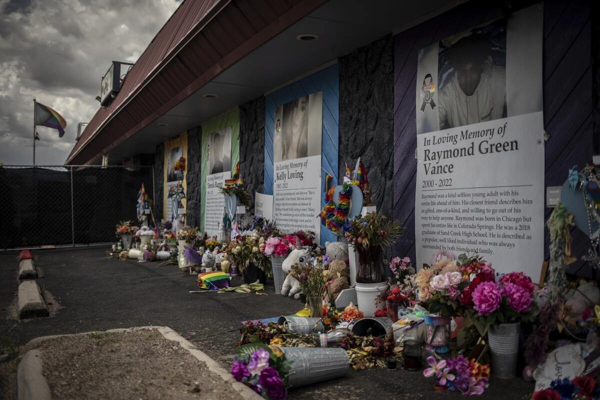 Flowers and posters outside LGBTQ+ nightclub that was site of mass shooting