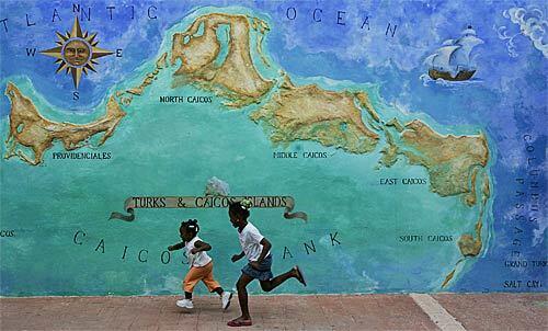 Two girls race past a mural on Providenciales -- Provo, to its familiars -- an island that is the main tourist center of Turks and Caicos Islands, a British crown colony east of Cuba in the Caribbean Sea. At TCI, 33,000 residents share their corner of paradise with about 300,000 tourists annually.