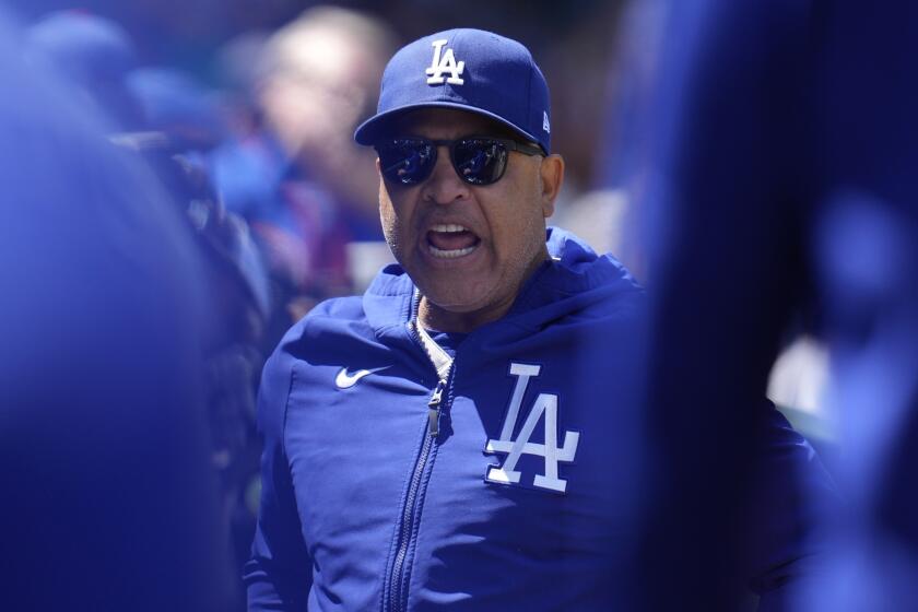 Los Angeles Dodgers manager Dave Roberts riles up players before the first inning.