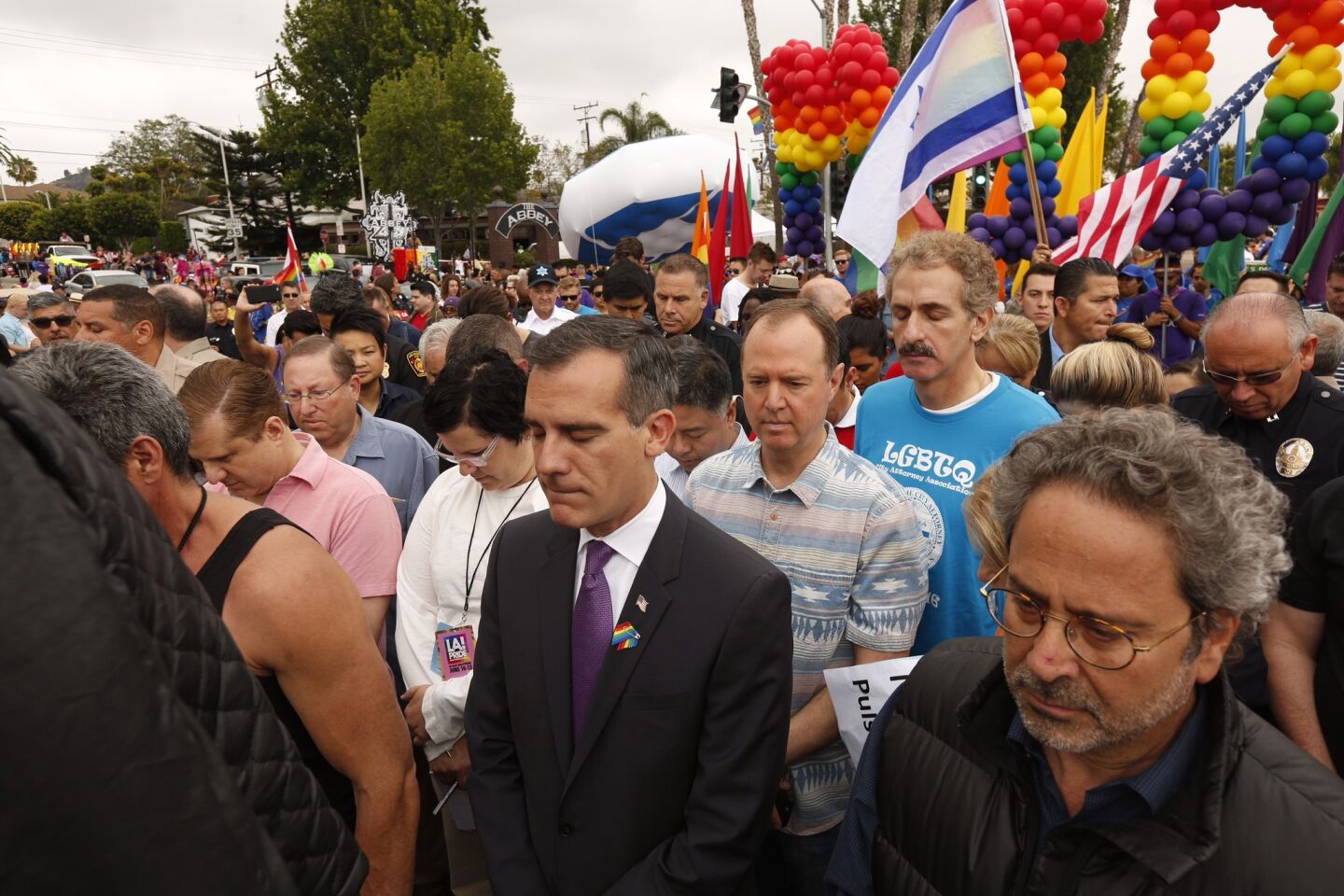 Los Angeles Mayor Eric Garcetti, center, and others have a moment of silence on June 12, 2016, in West Hollywood for the victims of the shooting in Orlando, Fla., that happened early that morning.