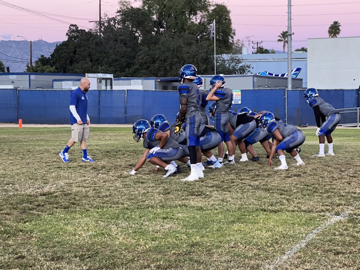 North Hollywood coach Scott Faer gets his team set to run the double-wing offense.