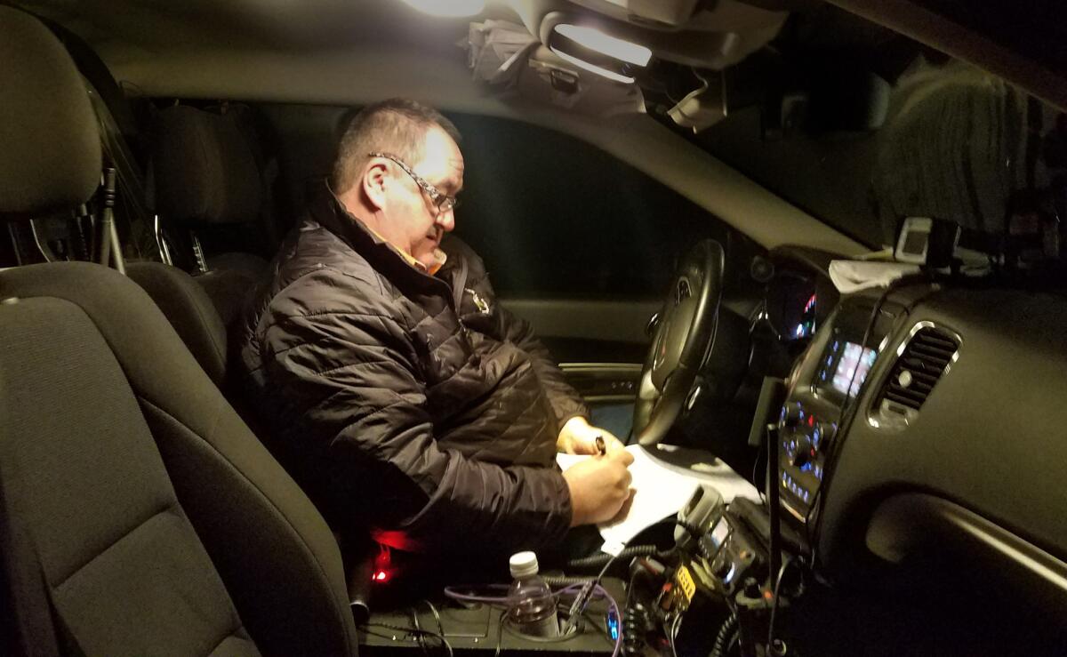 Martin County Sheriff John Kirk patrols in Inez, Ky.