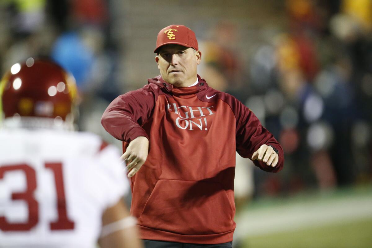 USC interim Coach Clay Helton coaches the Trojans against Colorado on Friday.