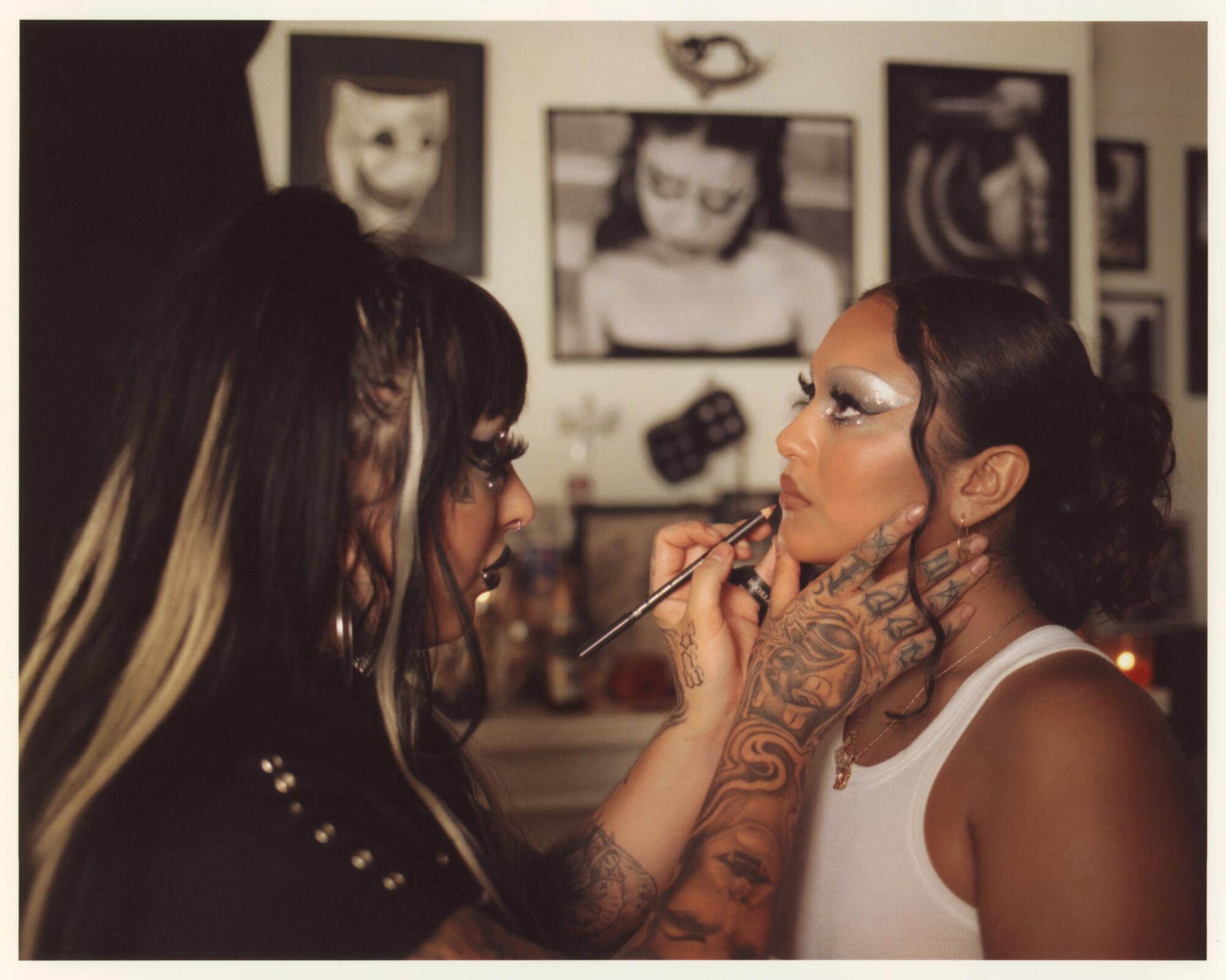 Photo of Selena Ruiz doing Sarita Fernandez's makeup.