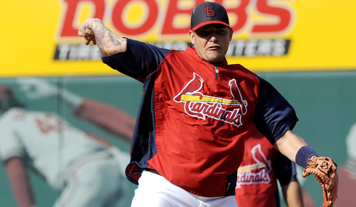 Cardinals catcher Yadier Molina warms up before a game against the Chicago Cubs on Friday evening at Busch Stadium in St. Louis.