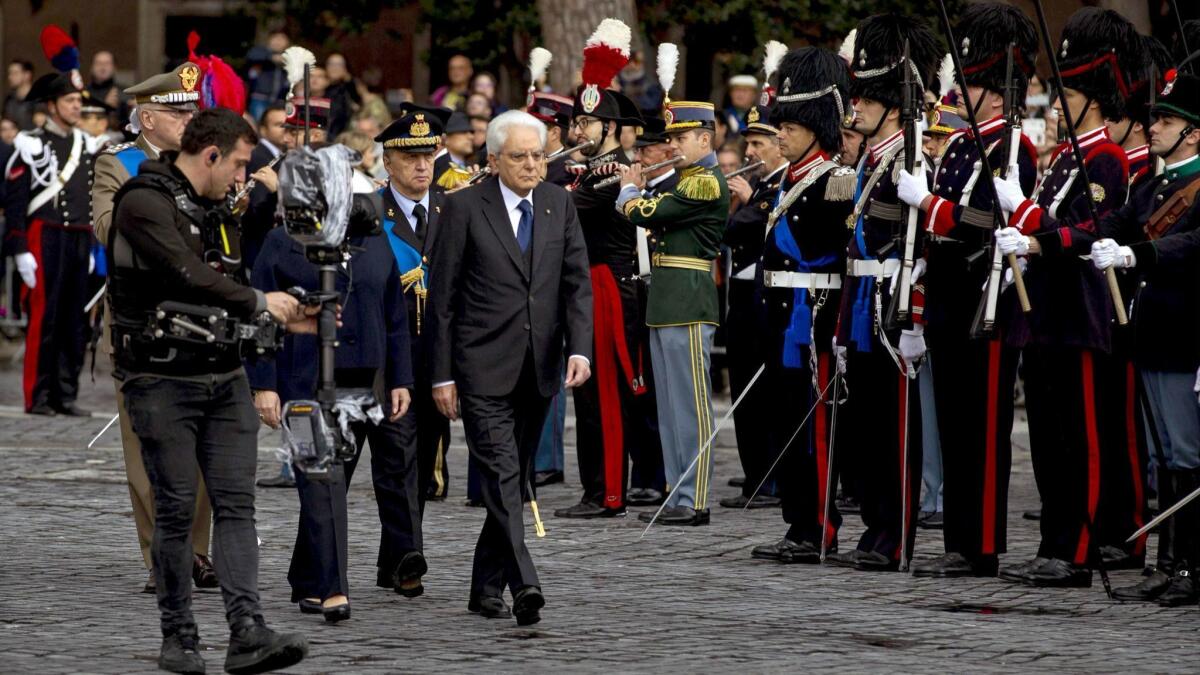 Italian President Sergio Mattarella, center, attends an Armed Forces Day ceremony Sunday in Rome.