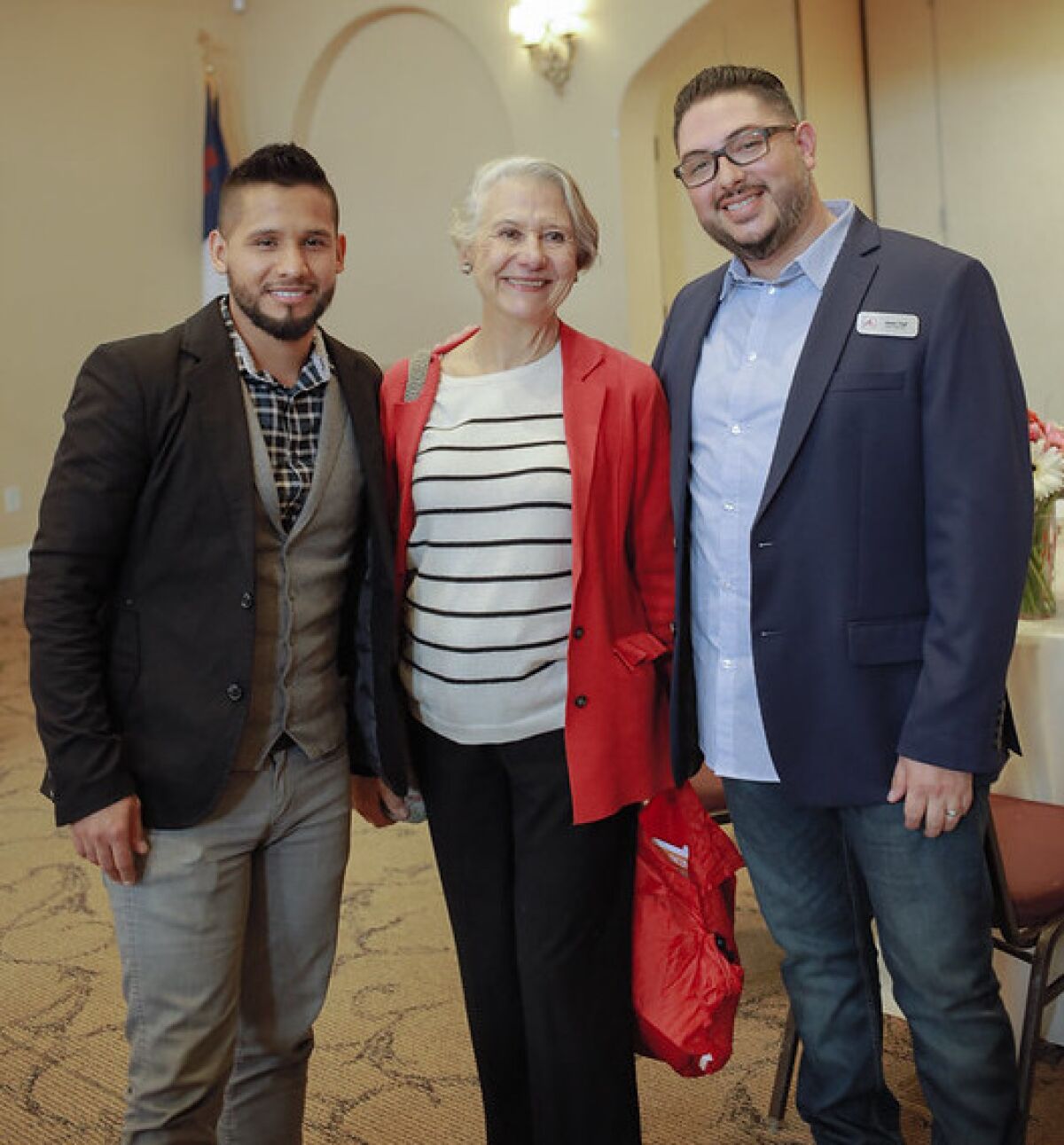 Edgar Uribe (left) with Piatti customer Martha Ehringer and Jesse Vigil of Big Table.