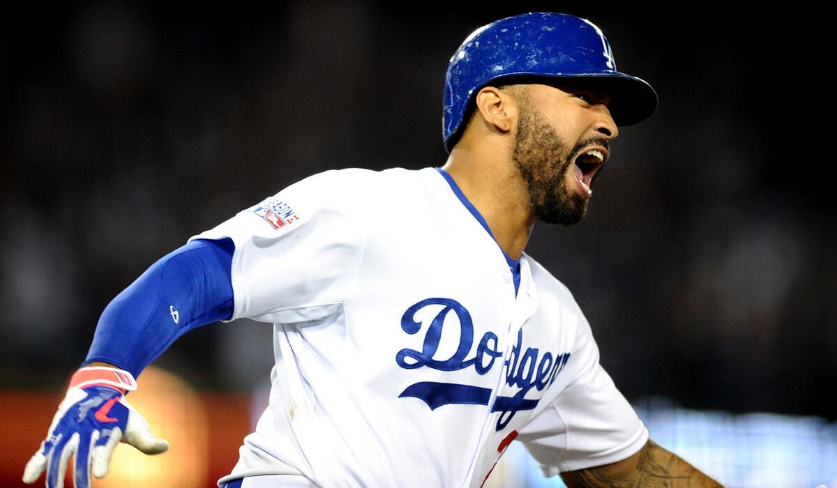 Dodgers right fielder Matt Kemp reacts after hitting a home run in the eighth inning that provided the winning margin in a 3-2 victory over the Cardinals.