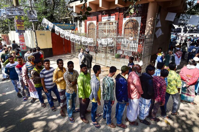 Bangladeshi voters wait in line outside a polling station in Dhaka on December 30, 2018. - Bangladesh headed to the polls on December 30 following a weeks-long campaign that was dominated by deadly violence and allegations of a crackdown on thousands of opposition activists. (Photo by Munir UZ ZAMAN / AFP) (Photo credit should read MUNIR UZ ZAMAN/AFP/Getty Images)