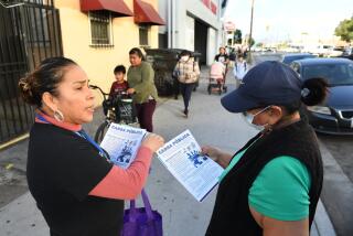 Los Angeles, California November 30, 2023-Juana Dominguez hands out information about Medi-Cal along Main St. in Los Angeles. The government program gears up for an upcoming expansion to serve eligible people of all ages regardless of immigration status. (Wally Skalij/Los Angeles Times)