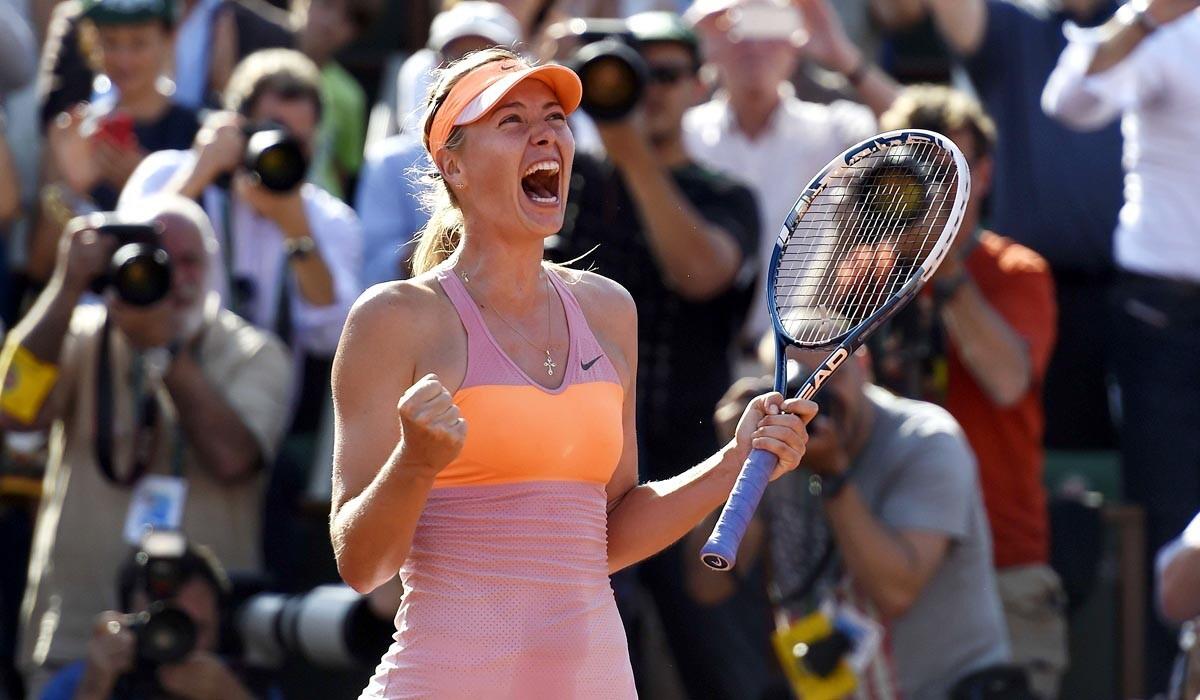 Maria Sharapova celebrates after defeating Simona Halep in the French Open final on Saturday in Paris.