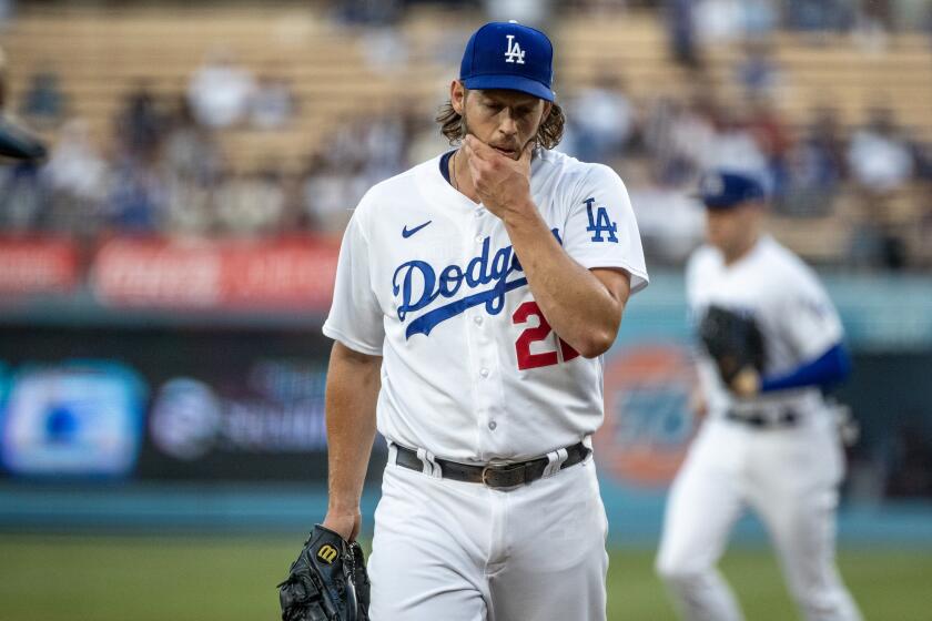 LOS ANGELES, CA - SEPTEMBER 23, 2023: Los Angeles Dodgers starting pitcher Clayton Kershaw (22)wipes his face after pitching against the San Francisco Giants in the first inning at Dodger Stadium on September 23, 2023 in Los Angeles, California.(Gina Ferazzi / Los Angeles Times)