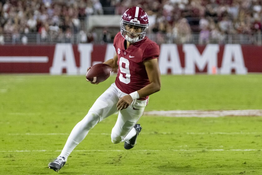 FILE - Alabama quarterback Bryce Young runs the ball against Tennessee during the first half of an NCAA college football game Saturday, Oct. 23, 2021, in Tuscaloosa, Ala. Young was selected to The Associated Press All-SEC team in results released Wednesday, Dec. 8, 2021. (AP Photo/Vasha Hunt, File)