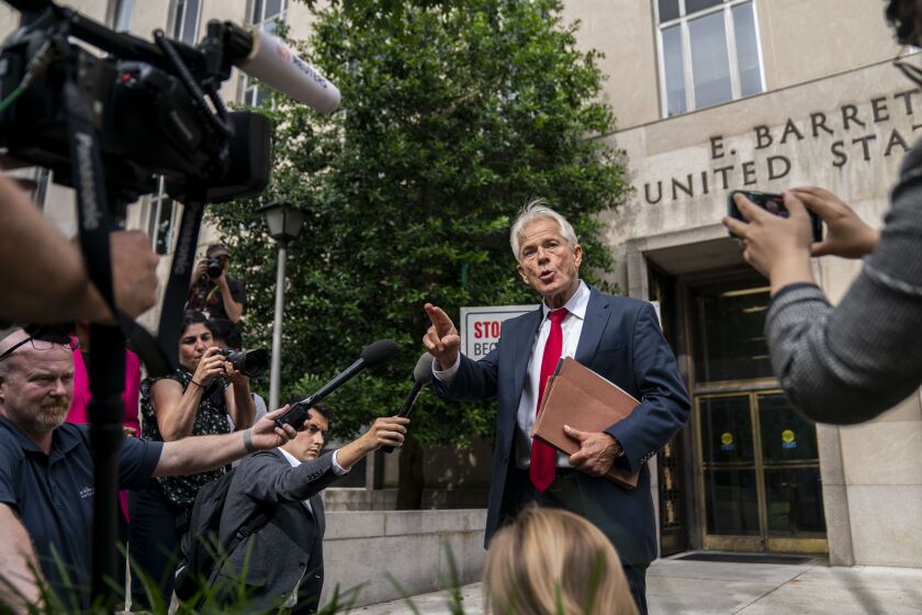 WASHINGTON, DC - JUNE 03: Former Trump White House Advisor Peter Navarro speaks to the media outside U.S. District Court on Friday, June 3, 2022 in Washington, DC. The former Trump aide was indicted by federal grand jury for contempt of Congress after he refused to cooperate with the House Committee's investigation into the January 6 insurrection. (Kent Nishimura / Los Angeles Times)