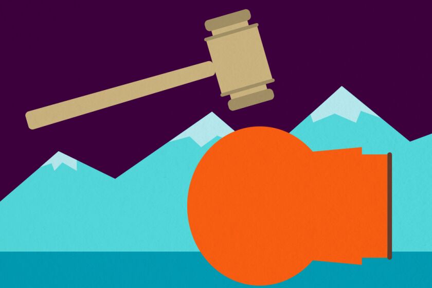A gavel hovers over a child in an orange parka lying on his side.