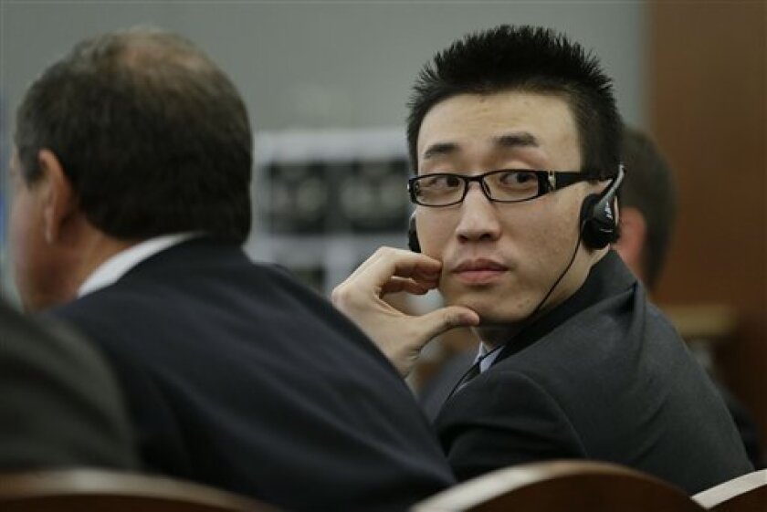 FILE - Xiao Ye Bai listens in Clark County Court as attorneys for the defense speak during arguments in his sentencing in this file photo taken Wednesday, Nov. 28, 2012, in Las Vegas. Bai will be sentenced Tuesday to life in a Nevada prison without parole for murder, but could get more than 100 additional years on other charges for a bloody stabbing and slashing that left one man dead and two people wounded in a Las Vegas karaoke bar. (AP Photo/Julie Jacobson, File)