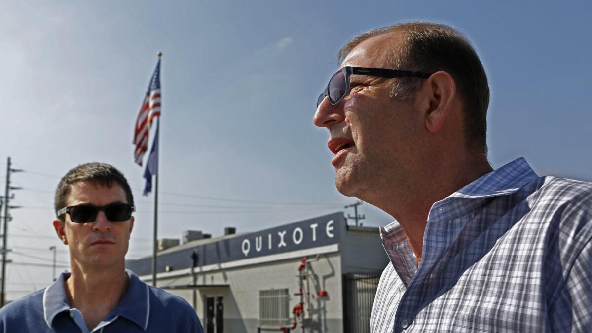 Adam Roodman, left, vice president of Quixote Studios in Los Angeles, listens to Steve Dayan of Teamsters Local 399 outside the studios. With union members set to vote on a proposed contract Saturday, it's looking less likely that the Teamsters will go on strike against commercial producers.
