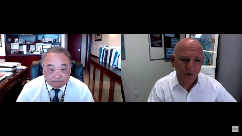 Newport Beach Chamber of Commerce president Steve Rosansky and Orange County chief executive officer Frank Kim.