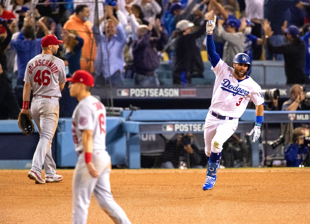 Taylor reacts while running the bases after his two-run homer wins the game against the St Louis Cardinals.