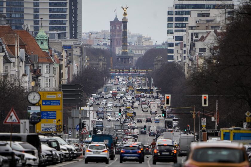 Traffic along Bismarkstrasse street in the direction of the city center of the German capital Berlin, Thursday, March 23, 2023. Voters in Berlin go to the polls this weekend to decide on a proposal that would force the city government to drastically ramp up the German capital’s climate goals. Sunday's referendum, which has attracted considerable financial support from U.S.-based philanthropists, calls for Berlin to become climate neutral by 2030, meaning that within less than eight years the city would not be allowed to contribute further to global warming. (AP Photo/Markus Schreiber)