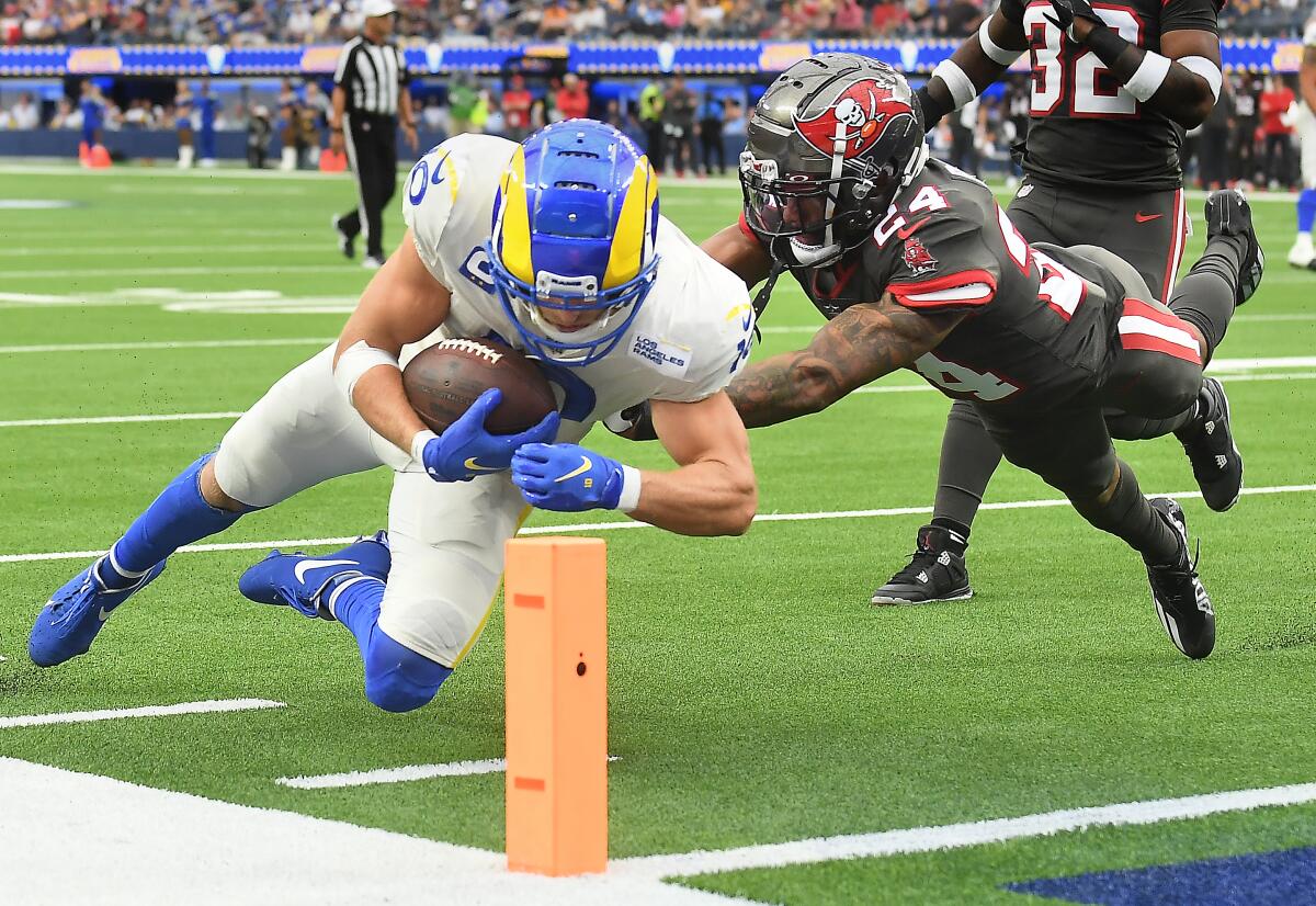 Rams receiver Cooper Kupp dives for the end zone for a touchdown in front of Buccaneers cornerback Carlton Davis.