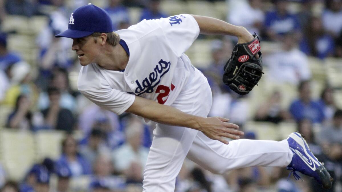 Dodgers starter Zack Greinke delivers a pitch during a game against the Cincinnati Reds in May. Until Sunday, individual Dodgers starters had only walked two or fewer batters in 39 consecutive games.