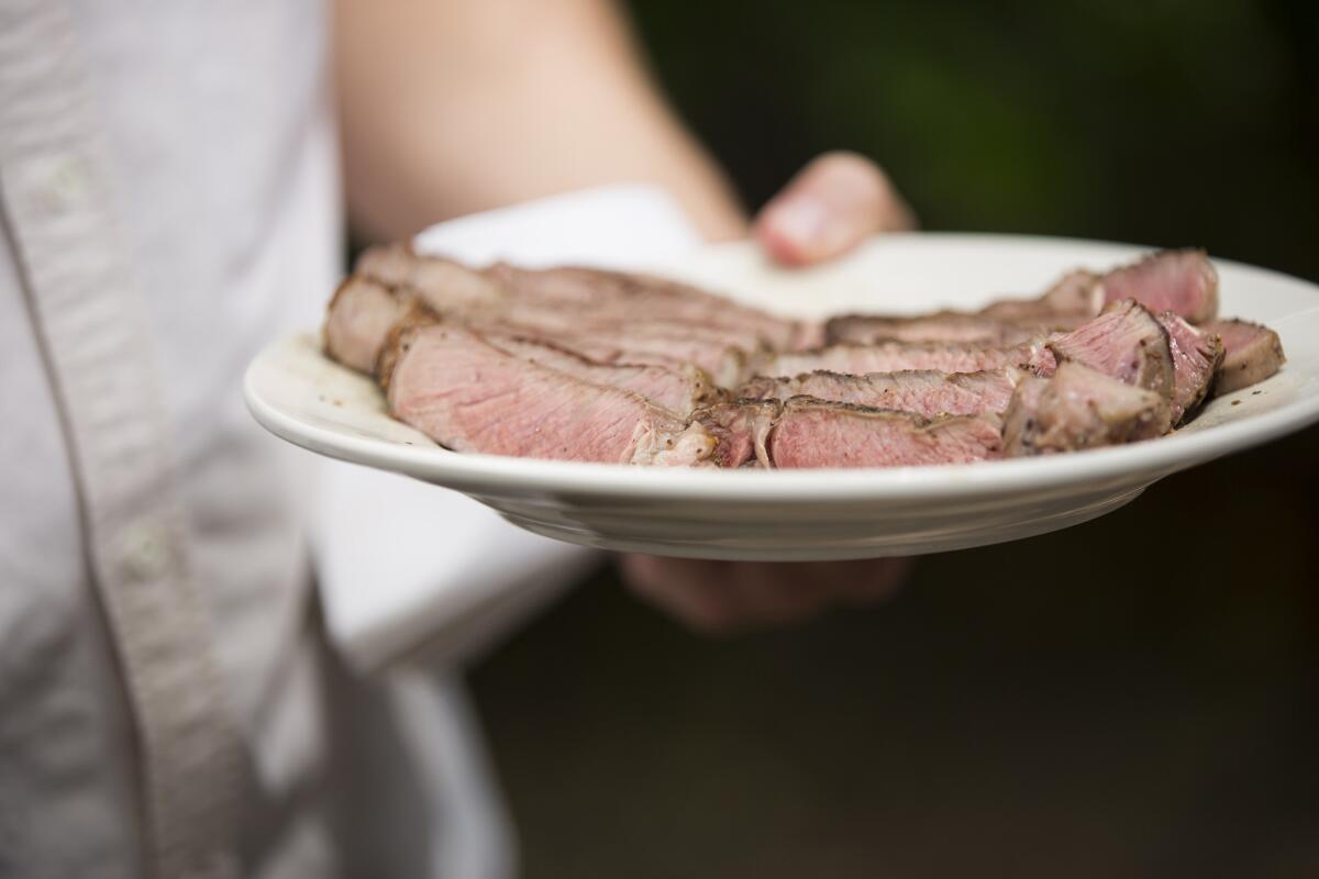 A plate of just-grilled steak is served at Curtis Stone's test kitchen in Beverly Hills.