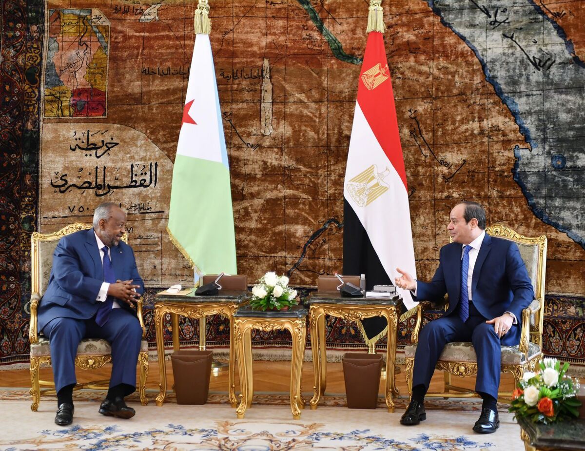 In this photo provided by Egypt's presidency media office, Egyptian President Abdel-Fattah el-Sissi, right, meets with the President of the Republic of Djibouti, Ismail Omar Guelleh, at the presidential palace, in Cairo, Egypt, Monday, Feb. 7, 2022. Egypt’s president on Monday hosted his Djiboutian counterpart for talks on improving ties and a controversial dam that Ethiopia is building on the Nile River’s main tributary, which Egypt deems an existential threat. (Egyptian Presidency Media Office via AP)