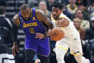 Los Angeles Lakers forward LeBron James (6) brings the ball up as Utah Jazz guard Ochai Agbaji.