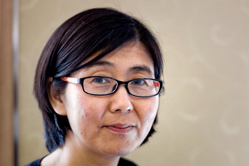 Wang Yu, the lawyer of late Chinese human rights activist Cao Shunli, poses during an interview in Hong Kong on March 20, 2014. The 52-year-old Cao, who died in police detention on March 14, 2014 in Beijing, was said to have dark marks all over her body, her lawyer disclosed, citing Cao's relatives. Cao was set to travel to Switzerland to take part in a UN Human Rights Council review last September but police detained her at Beijing's international airport, her lawyer Wang Yu told AFP on March 14. AFP PHOTO / Philippe Lopez (Photo credit should read PHILIPPE LOPEZ/AFP via Getty Images)