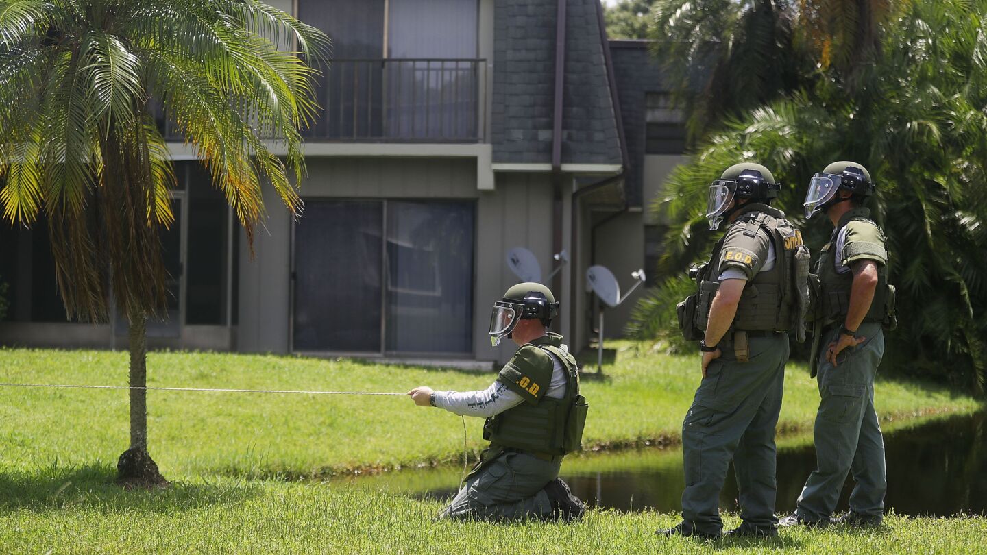 A bomb disposal unit checks for explosives around the apartment building where shooting suspect Omar Mateen is believed to have lived on June 12, 2016 in Fort Pierce, Florida.