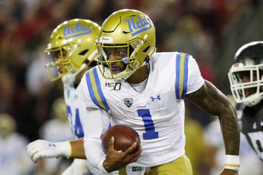 UCLA quarterback Dorian Thompson-Robinson (1) runs with the ball during the second half.