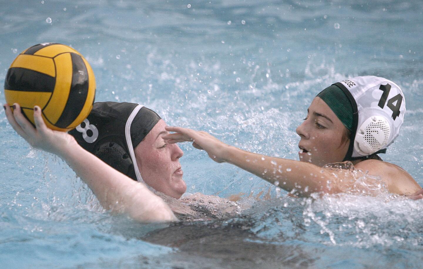 Flintridge Sacred Heart Academy water polo player #8 Devin Aubert is pressured by Westridge player #14 Amanda Matthiessen during home game at FSHA in La Canada Flintridge on Thursday, November 29, 2012.