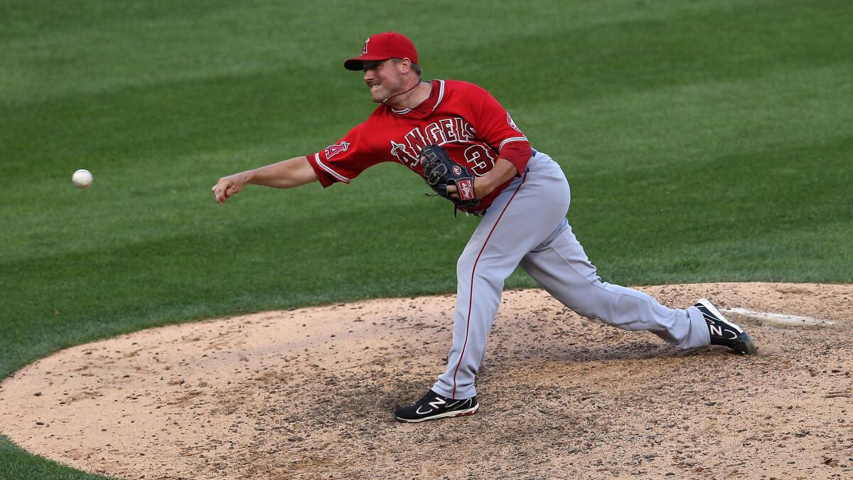 Angels closer Joe Smith delivers a pitch during the ninth inning of the team's 8-4 win over the Chicago White Sox in the first game of a doubleheader Tuesday.